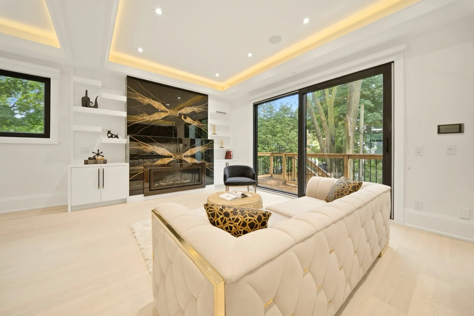 HDR living room photo toward the walkout deck and mature trees