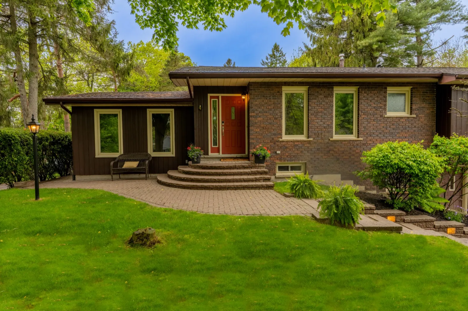 4 Cedar St, Port Colborne — front exterior with red door at the stone steps