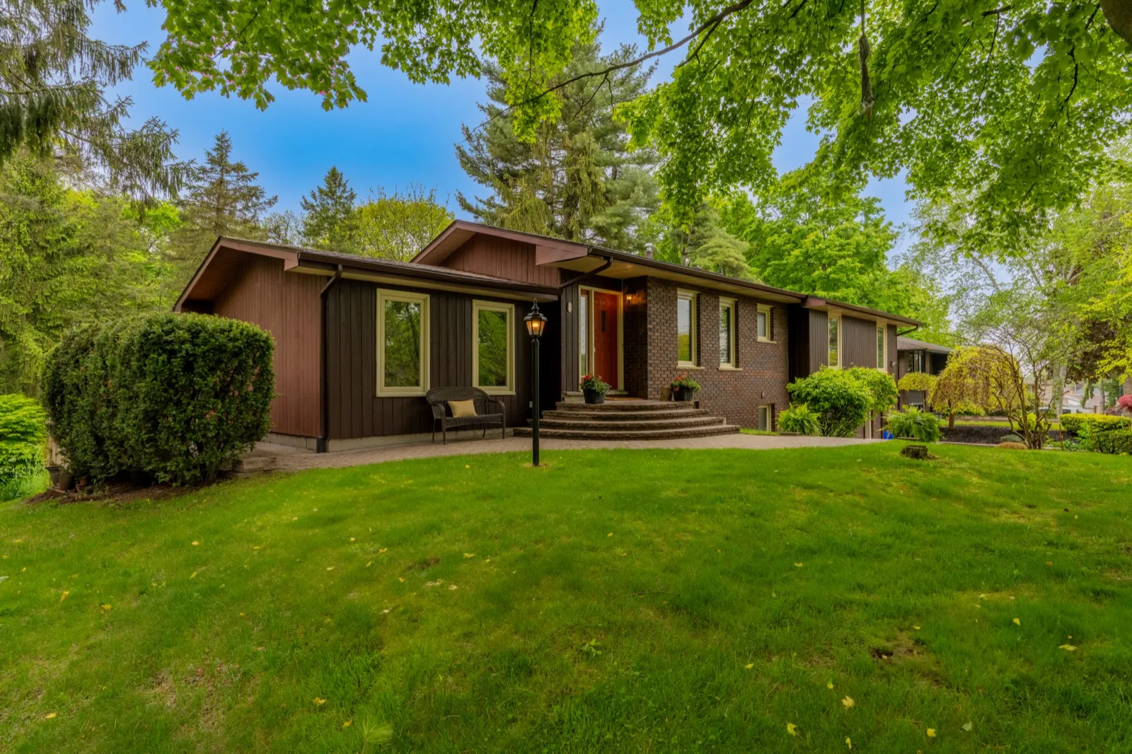 4 Cedar St, Port Colborne — mid-century bungalow exterior across the front lawn