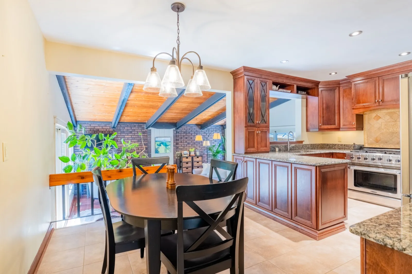 4 Cedar St, Port Colborne — kitchen and breakfast table under the vaulted wood ceiling