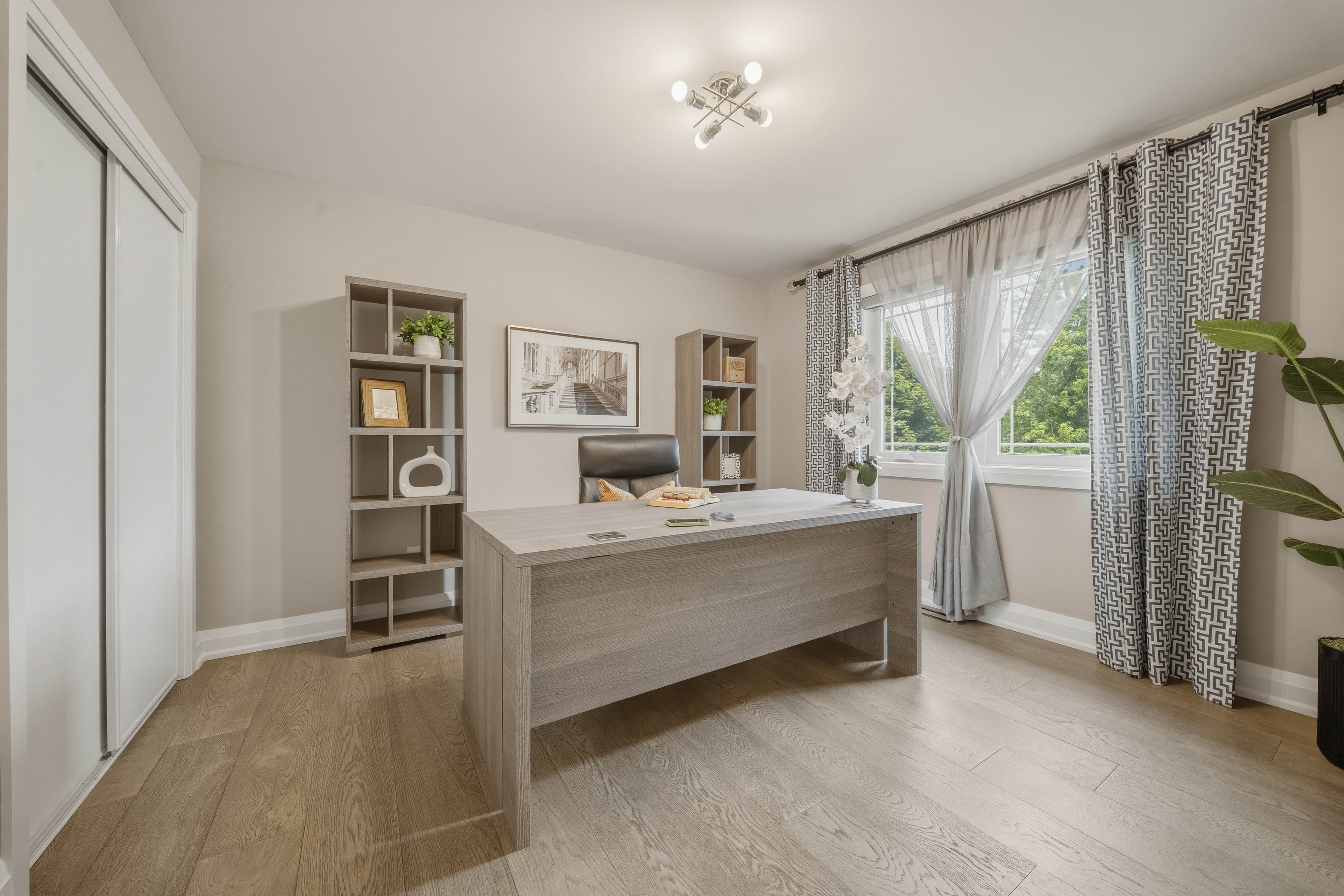 294 Tanbark Road, Niagara-on-the-Lake — secondary bedroom used as a home office with built-in shelving and sheer curtains