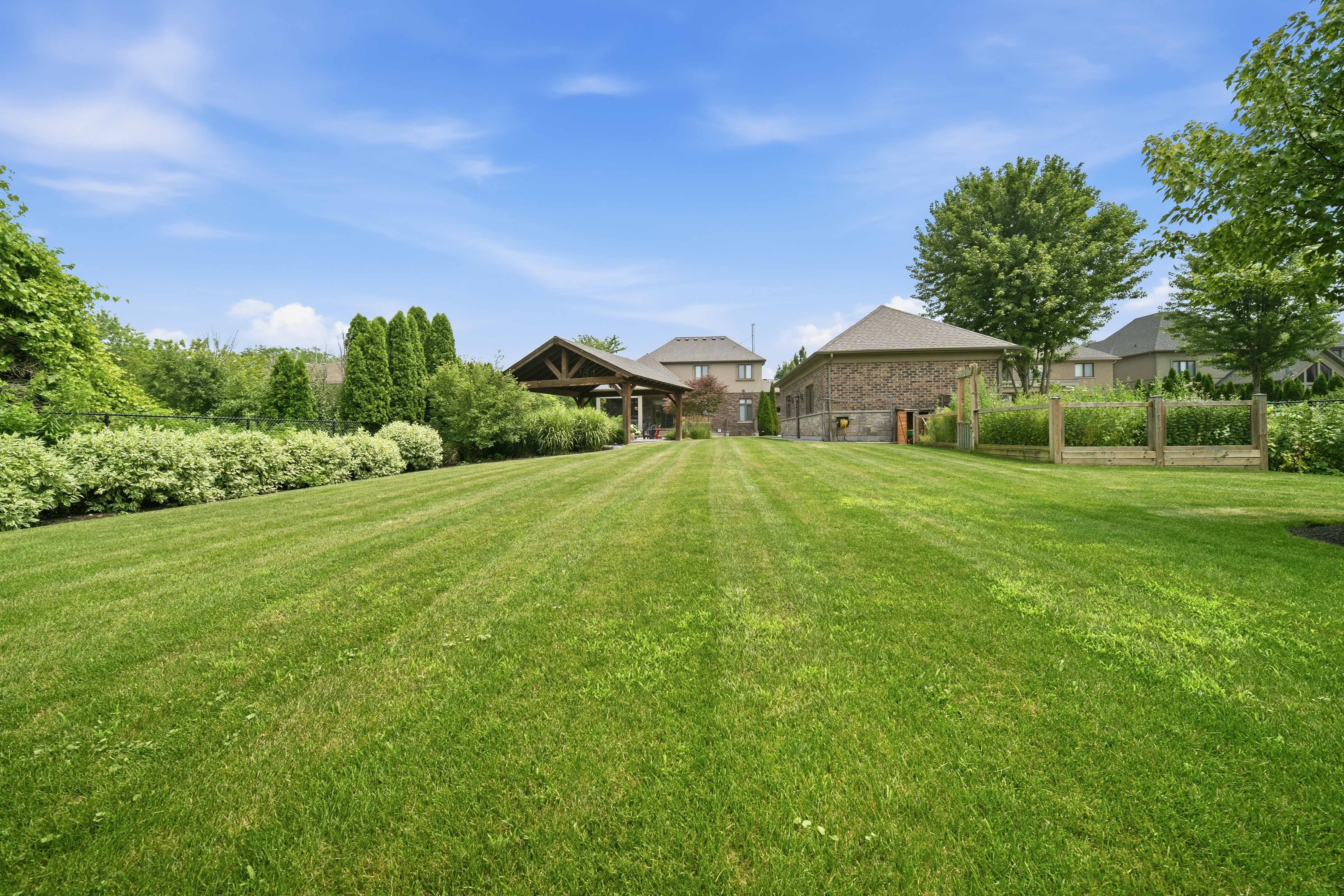 294 Tanbark Road, Niagara-on-the-Lake — deep rear lawn looking back toward the house and covered pavilion