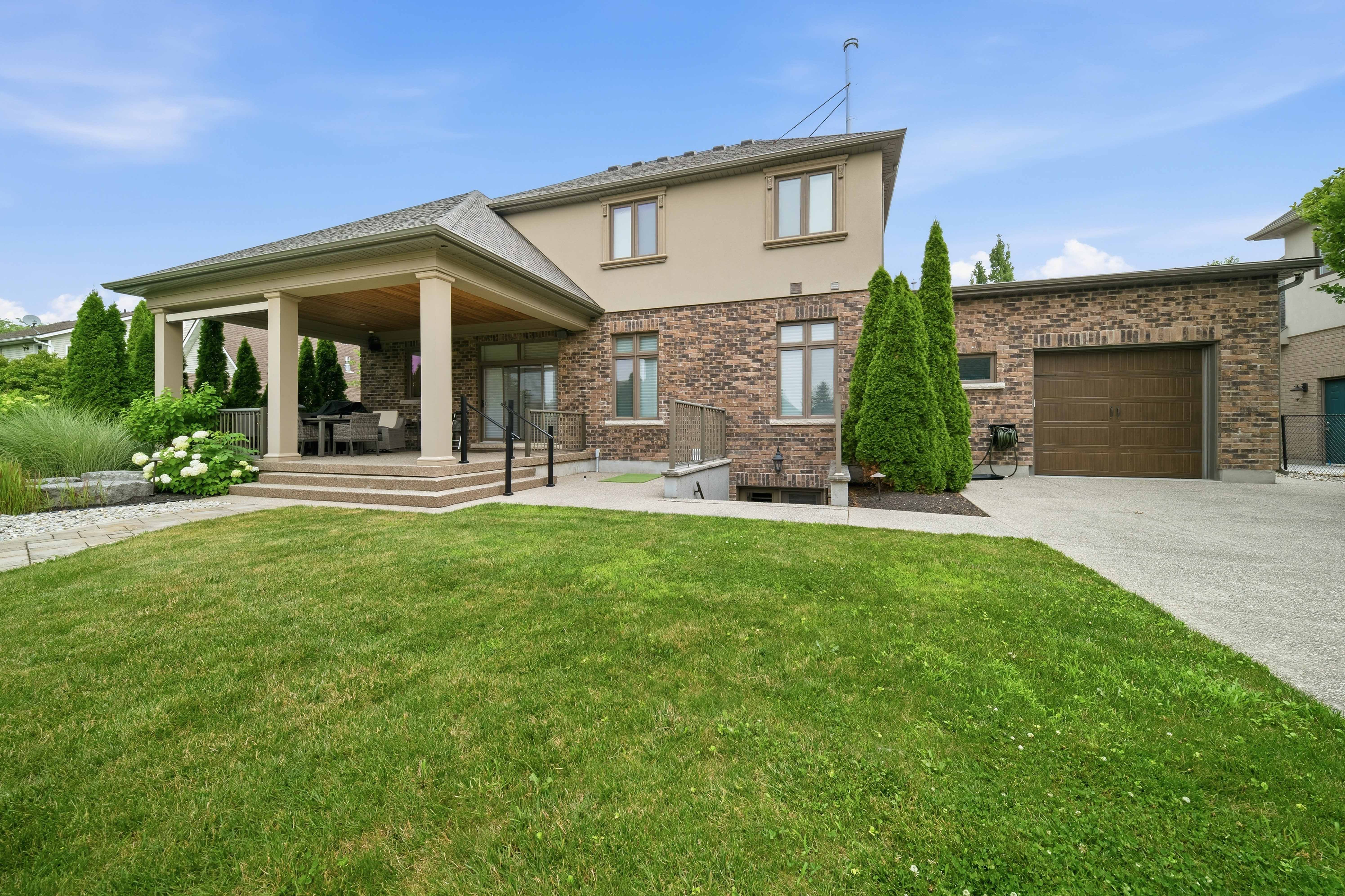 294 Tanbark Road, Niagara-on-the-Lake — rear elevation with covered porch and columns overlooking the lawn