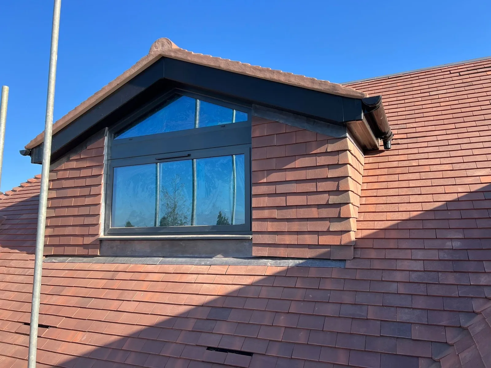 Completed dormer loft conversion with full height glazing in Southgate N14