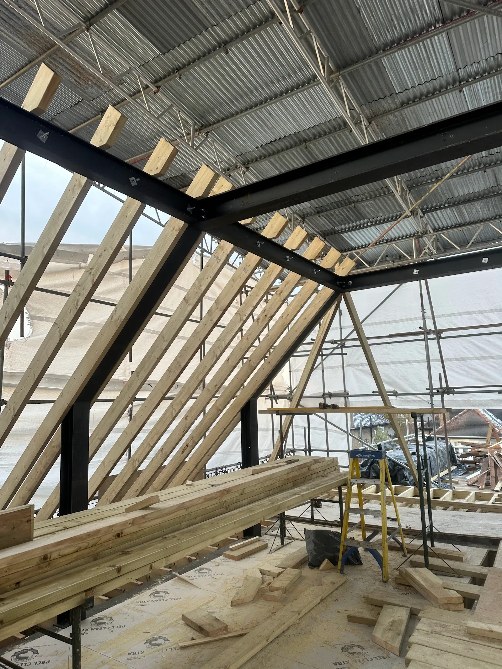 Steel beam installed to support new roof structure during a loft conversion in Southgate N14