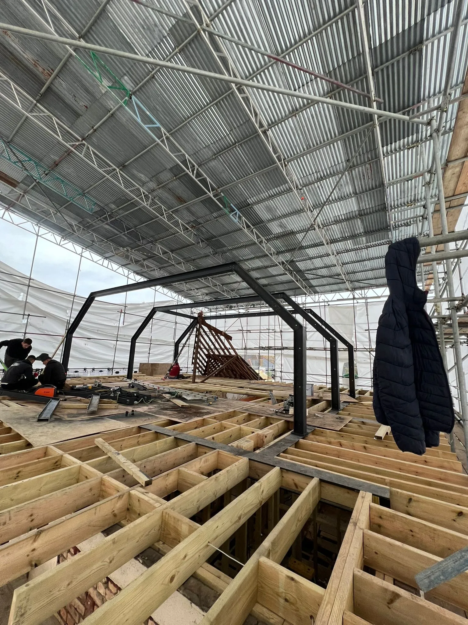 Roof stripped back under full scaffold on a Southgate N14 loft conversion