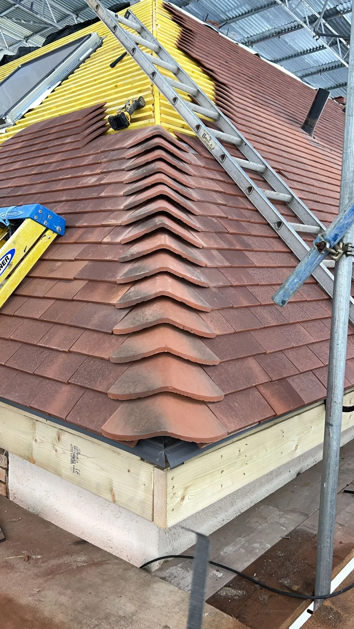 Hip roof being tiled during a loft conversion in Southgate N14