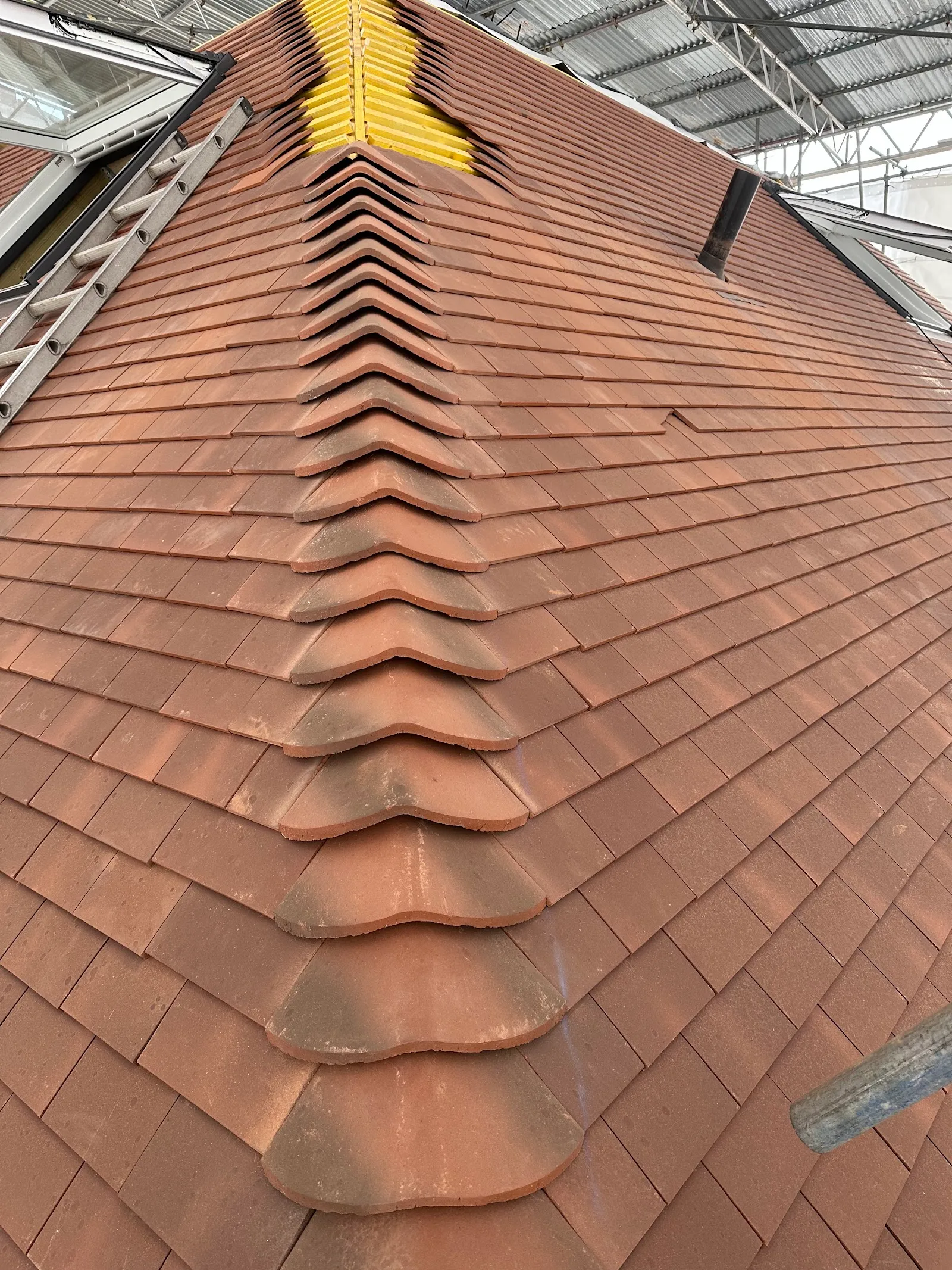 Bonnet hip tiles running to the apex of a rebuilt Southgate roof