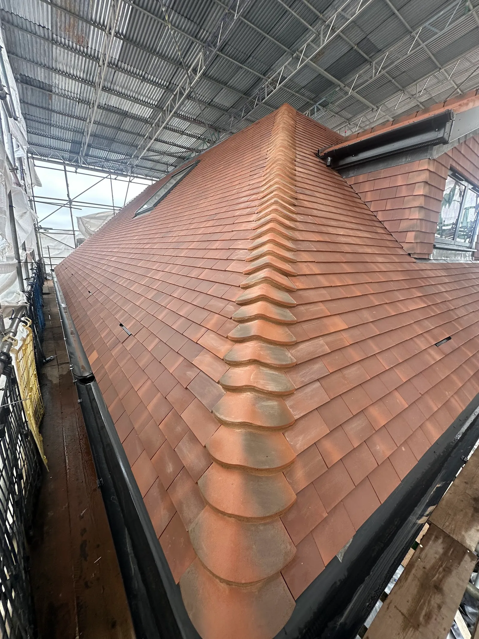 Close detail of bonnet hip tiling on a Southgate N14 roof
