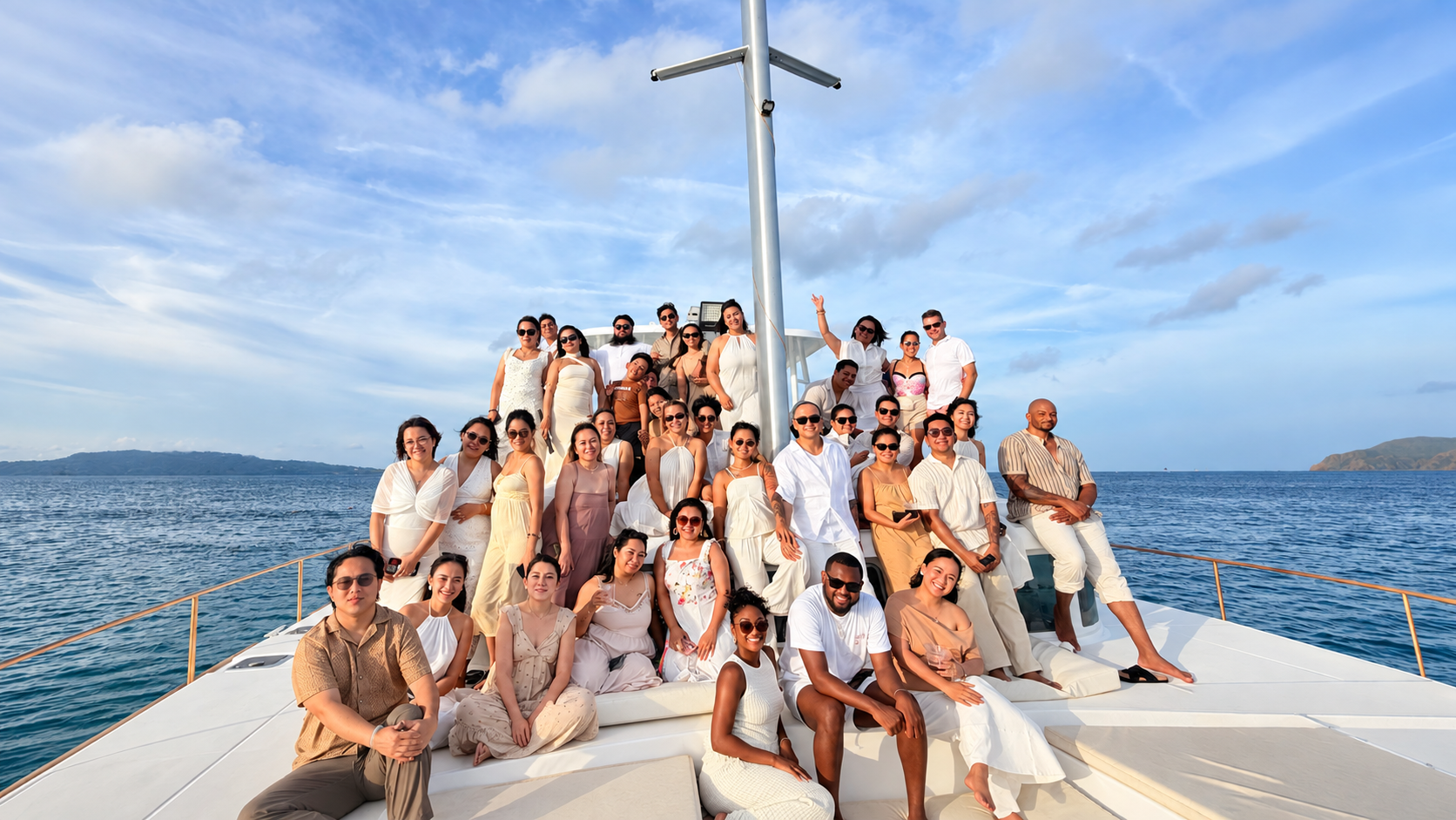 S Universe team on a yacht at golden hour