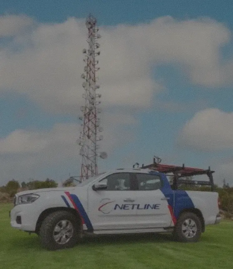 Netline branded service truck parked beside a telecom tower, Netlink customer story.