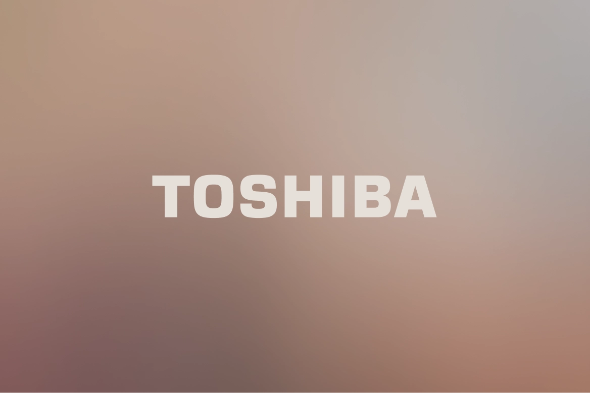 Toshiba logo on a soft brown and grey gradient background.