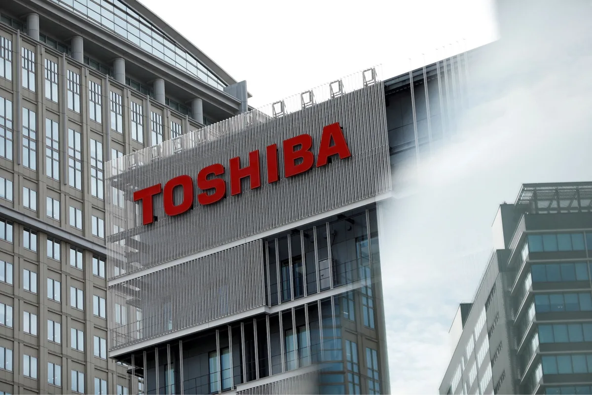 Toshiba logo in red on the facade of a Toshiba office building.