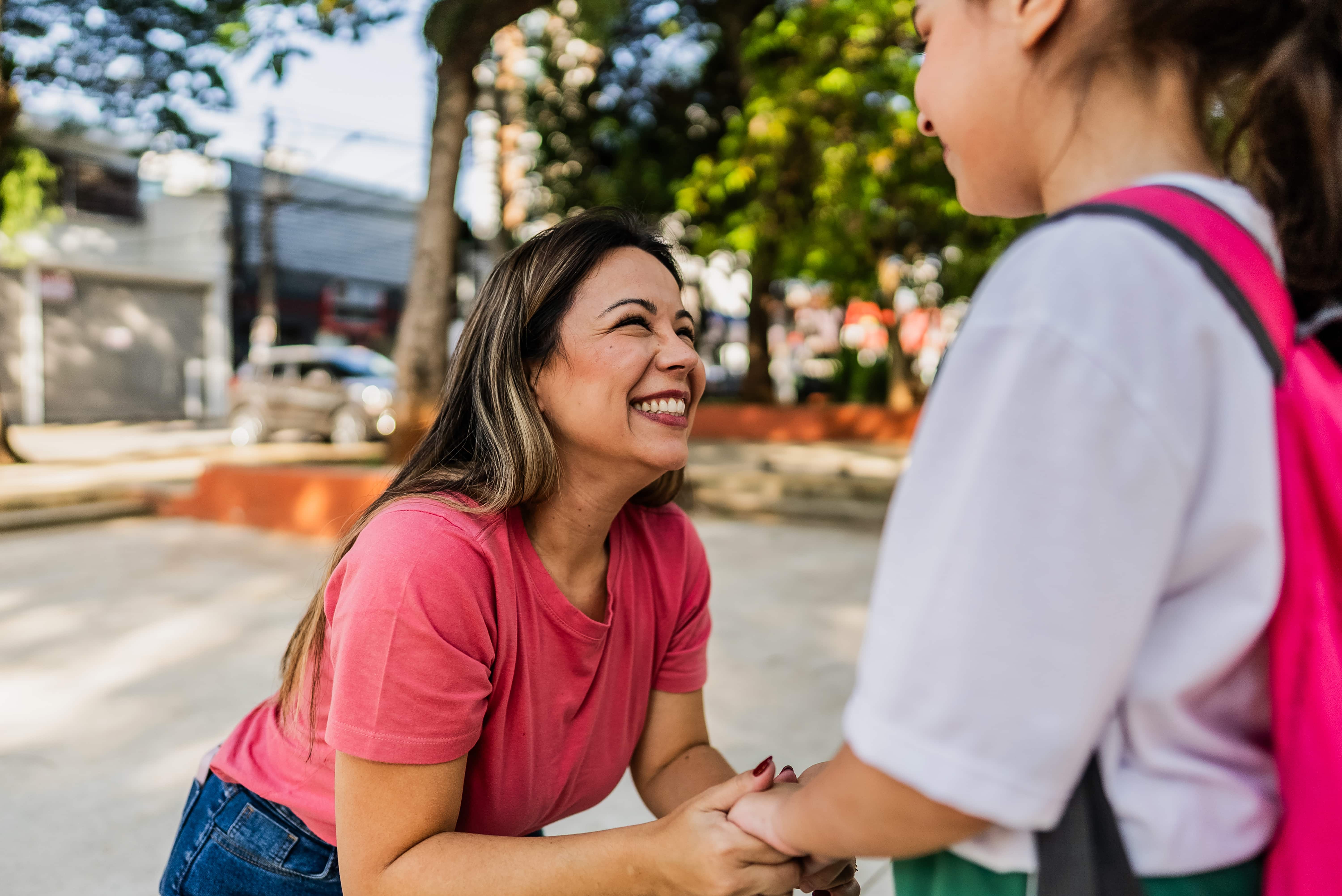 woman supporting children in afterschool program