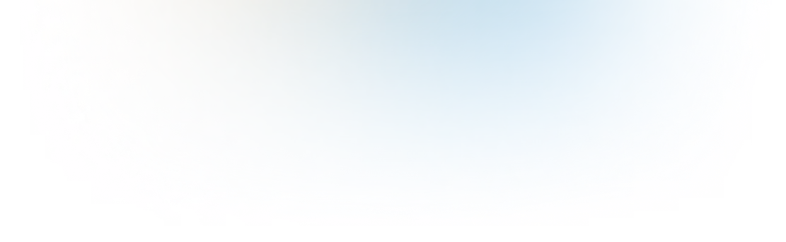 Soft blurred gradient glow fading from pale yellow to light blue on a dark background.