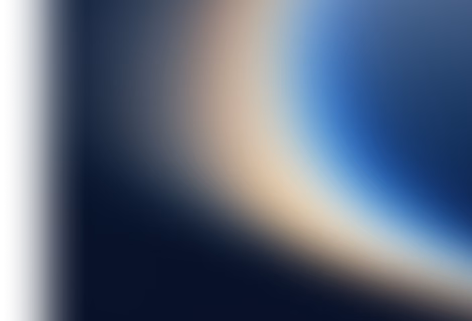 Abstract gradient with soft blurred blue, beige, and dark tones blending diagonally.
