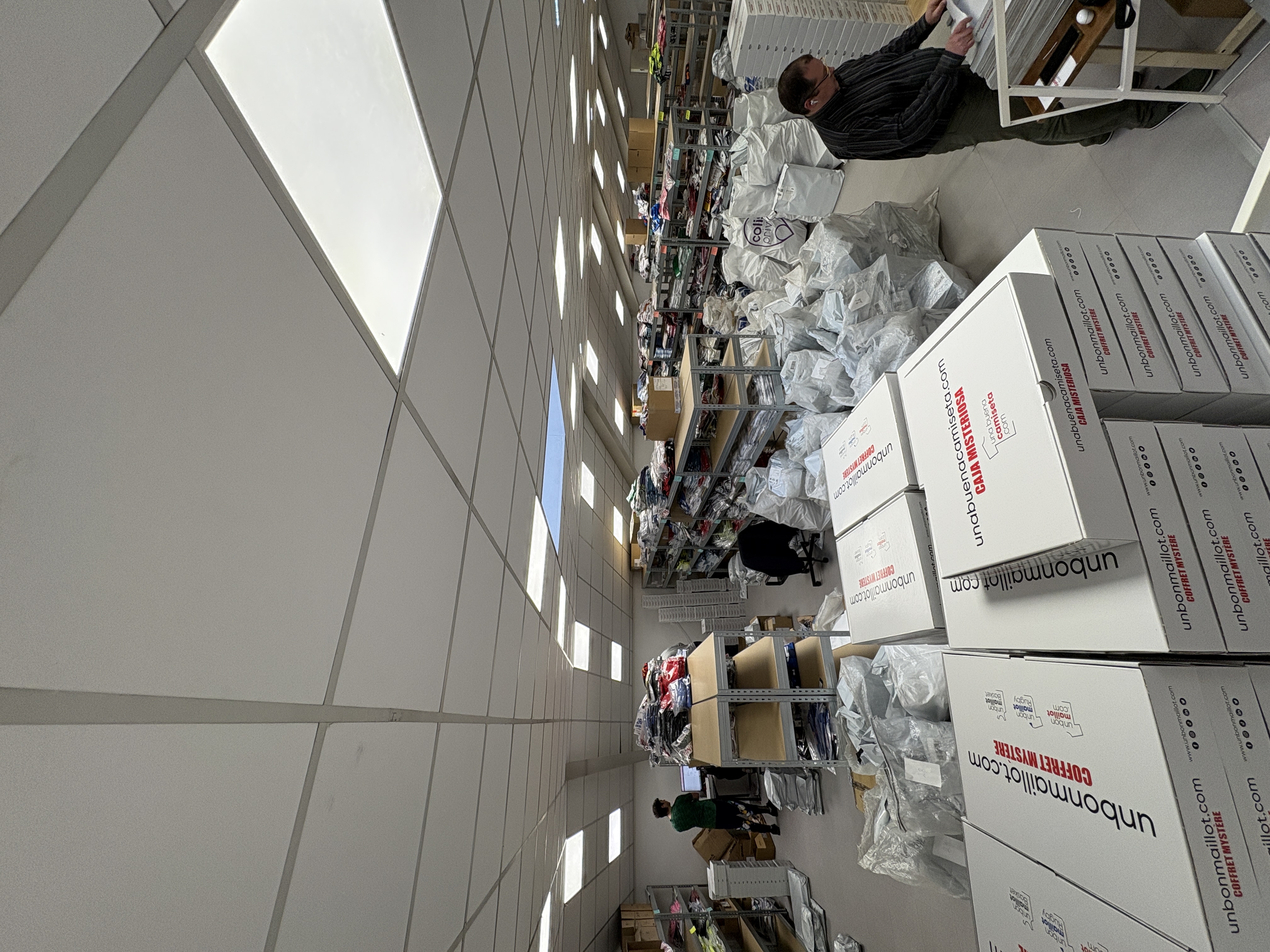 image capturing a creative, interactive exhibit at a humanitarian aid fundraising event, emphasizing modern engagement