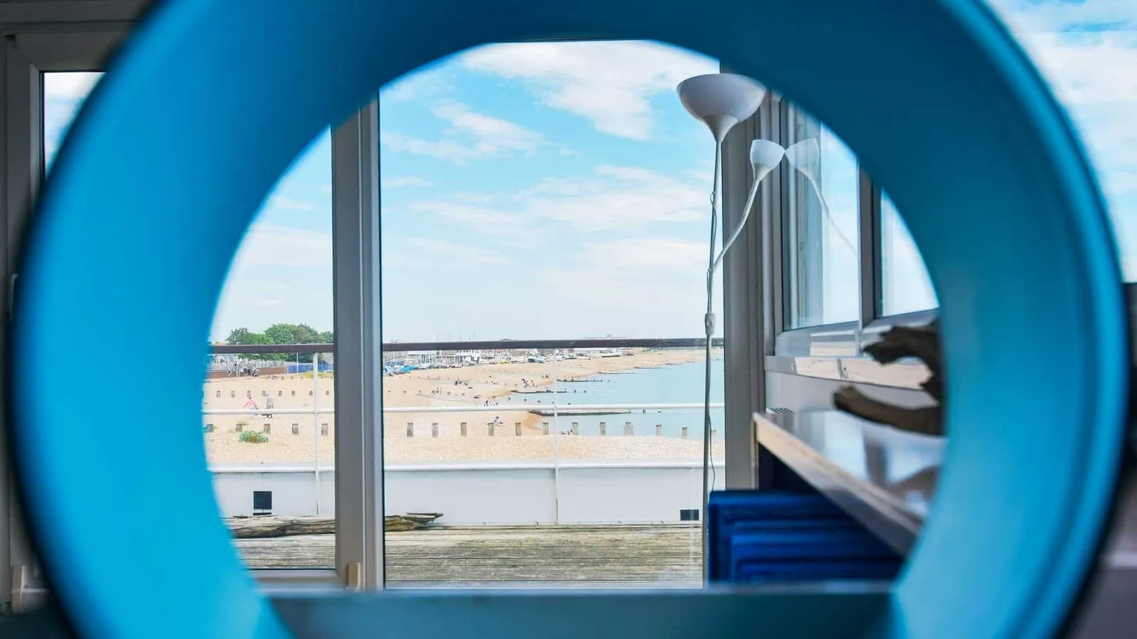 A view of Eastbourne beach through an excerises drum.