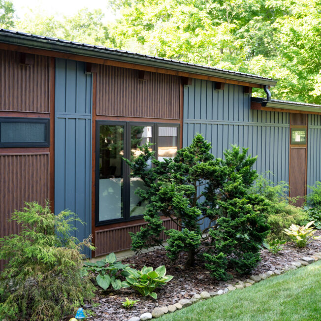 Modern home with ProVia CedarMAX board and batten siding in Sea Slate