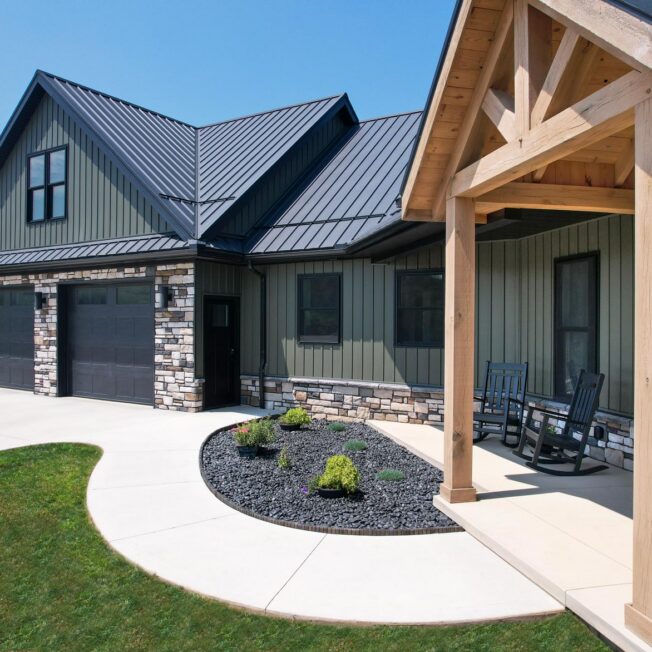 Home exterior with ProVia CedarMAX board and batten siding in Pine