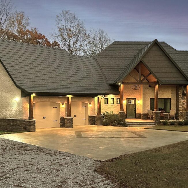 Home at dusk with ProVia Larkstone Slate metal roofing