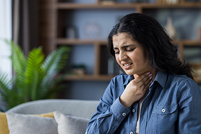 woman with post nasal drip in discomfort