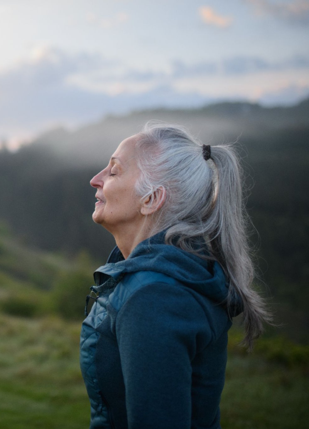 Person breathing through their nose comfortably, eyes closed, looking relieved, representing improved nasal airflow