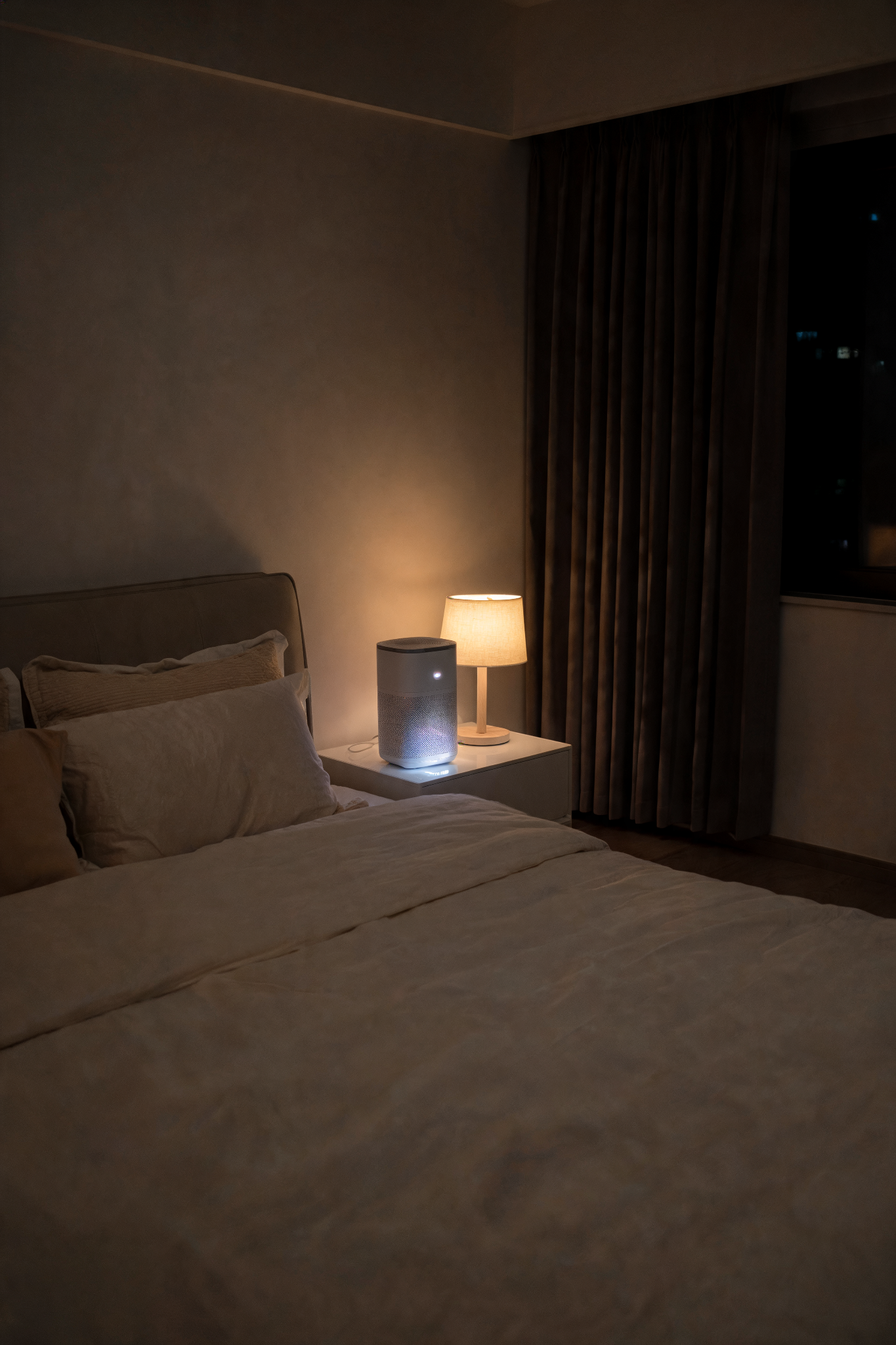 A clean bedroom with an air purifier on the nightstand, representing steps to reduce nighttime allergens that worsen sinus symptoms during sleep