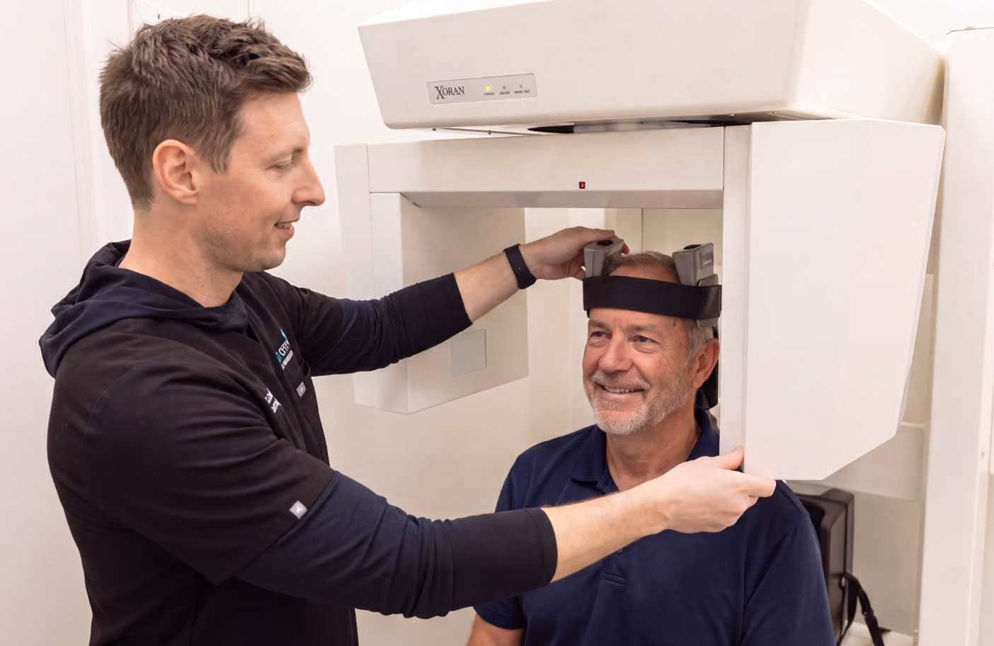 Dr. Caleb at B&B sinus and allergy performing x-ray on patient