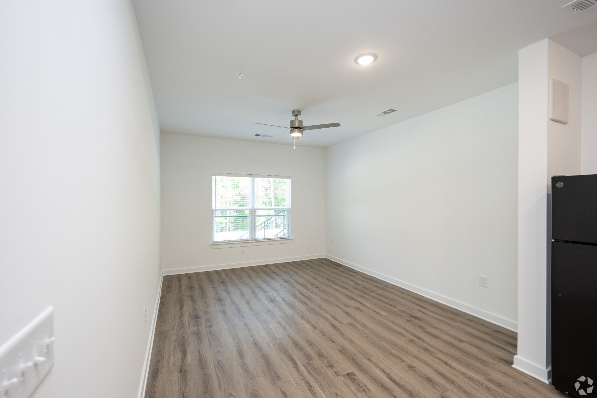 Unfurnished living area with large window