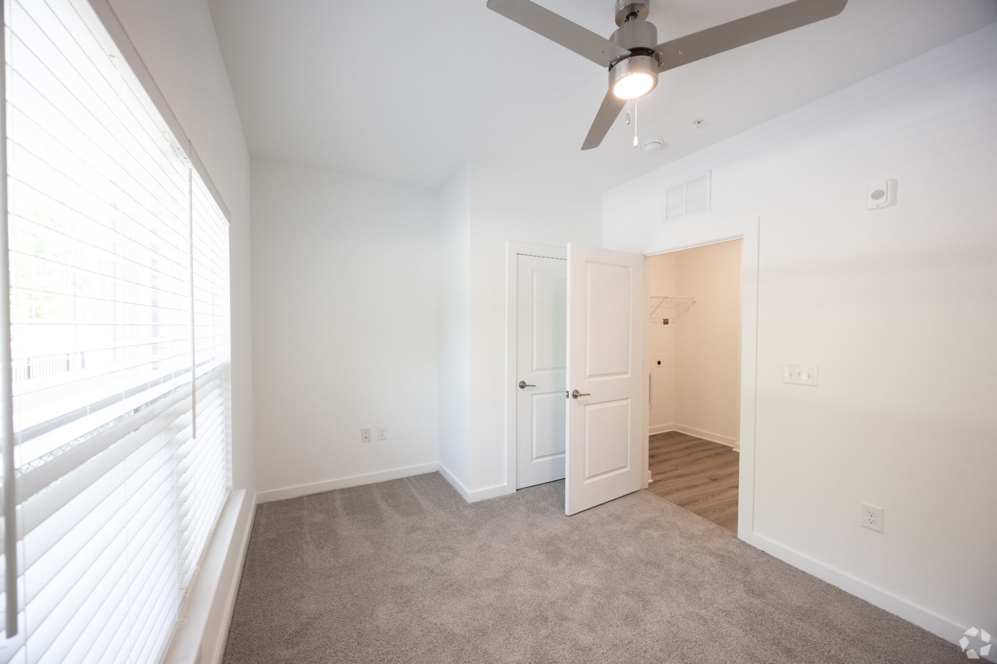 Bedroom with carpet and ceiling fan