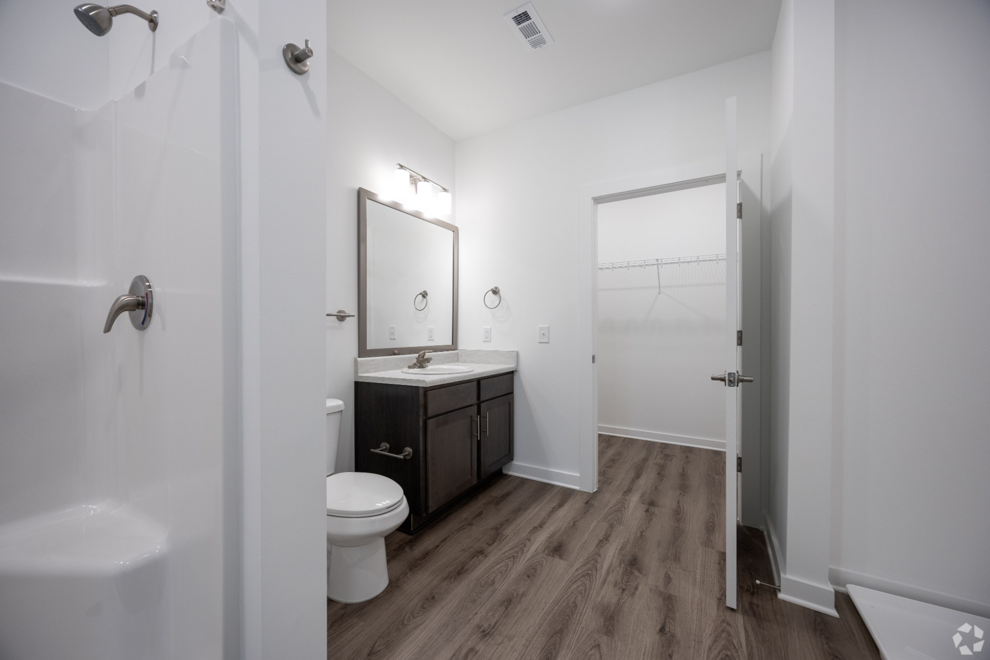 Bathroom with vanity and closet