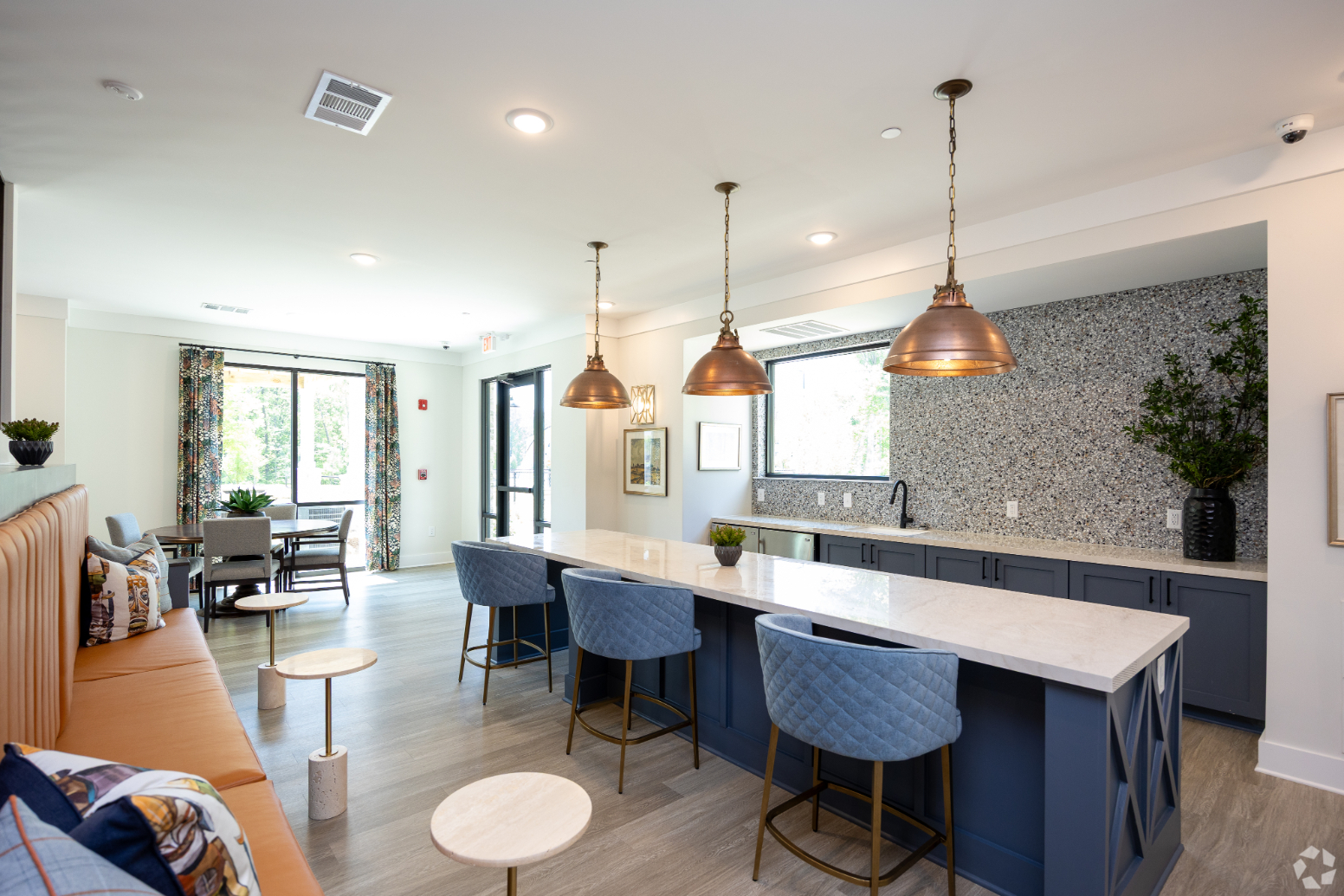 Lounge with kitchen, bar, and seating