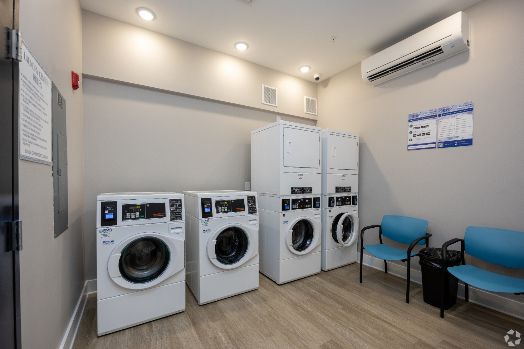 Laundry facility with appliances and chairs