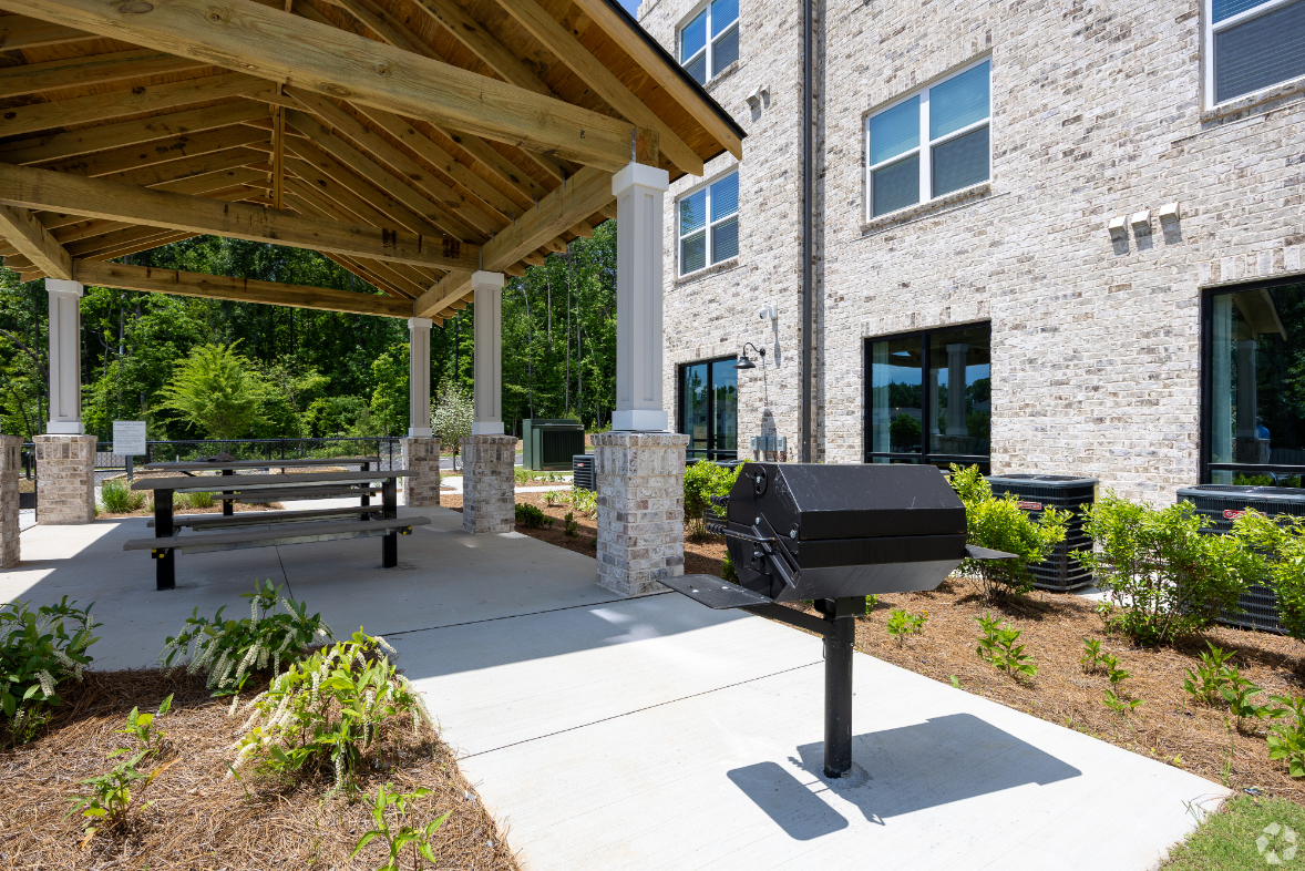 BBQ area with grill and picnic tables