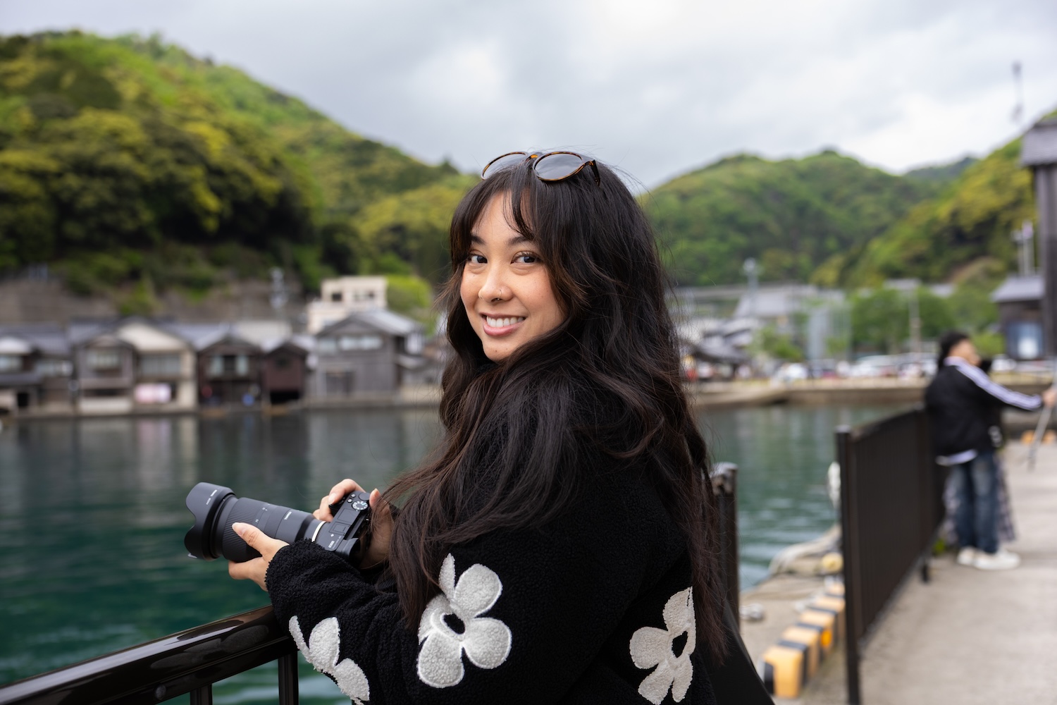 Breana Mae smiling on a street in Japan
