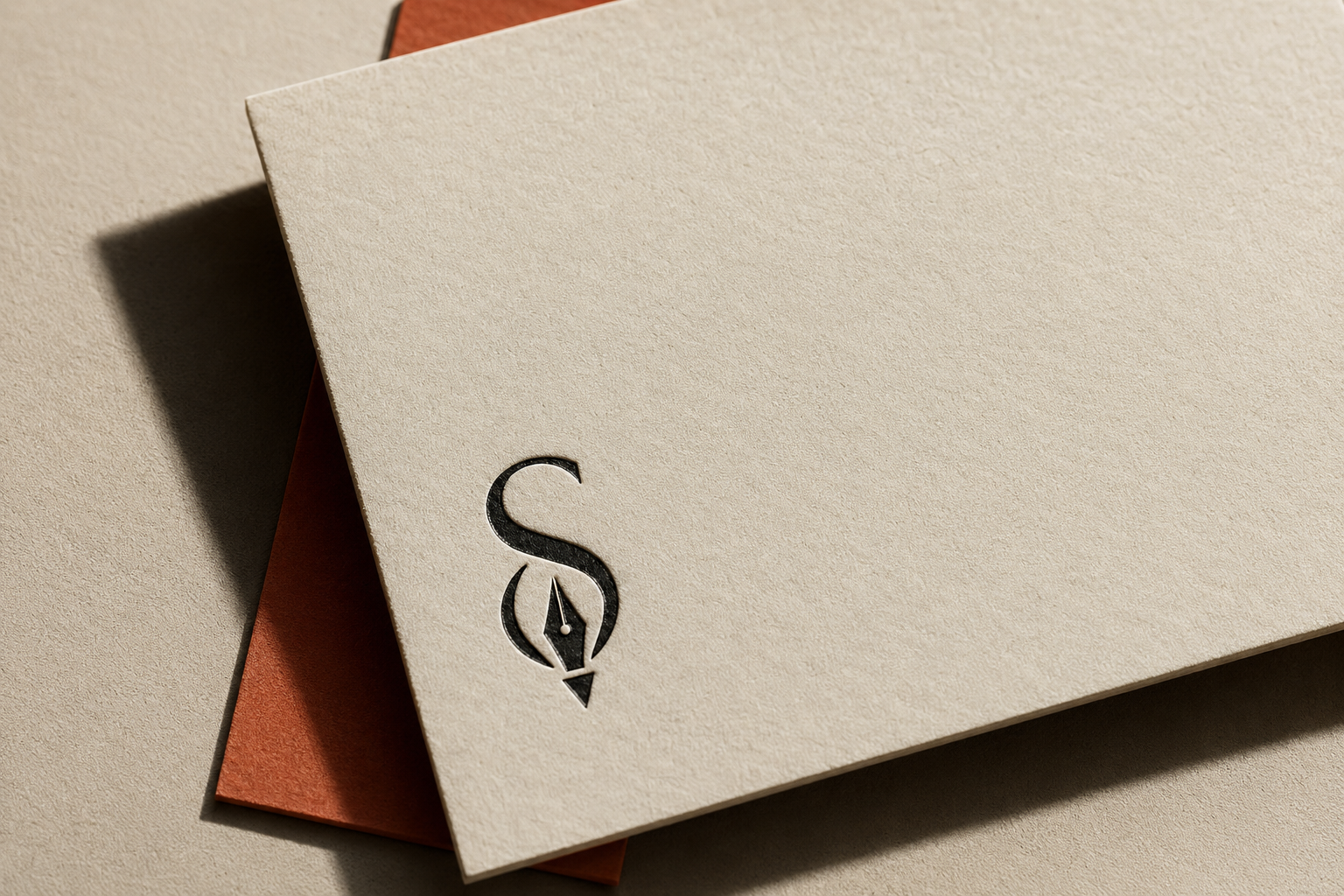 Stack of textured papers with a black stylized pen nib and 'S' logo embossed on top paper corner.