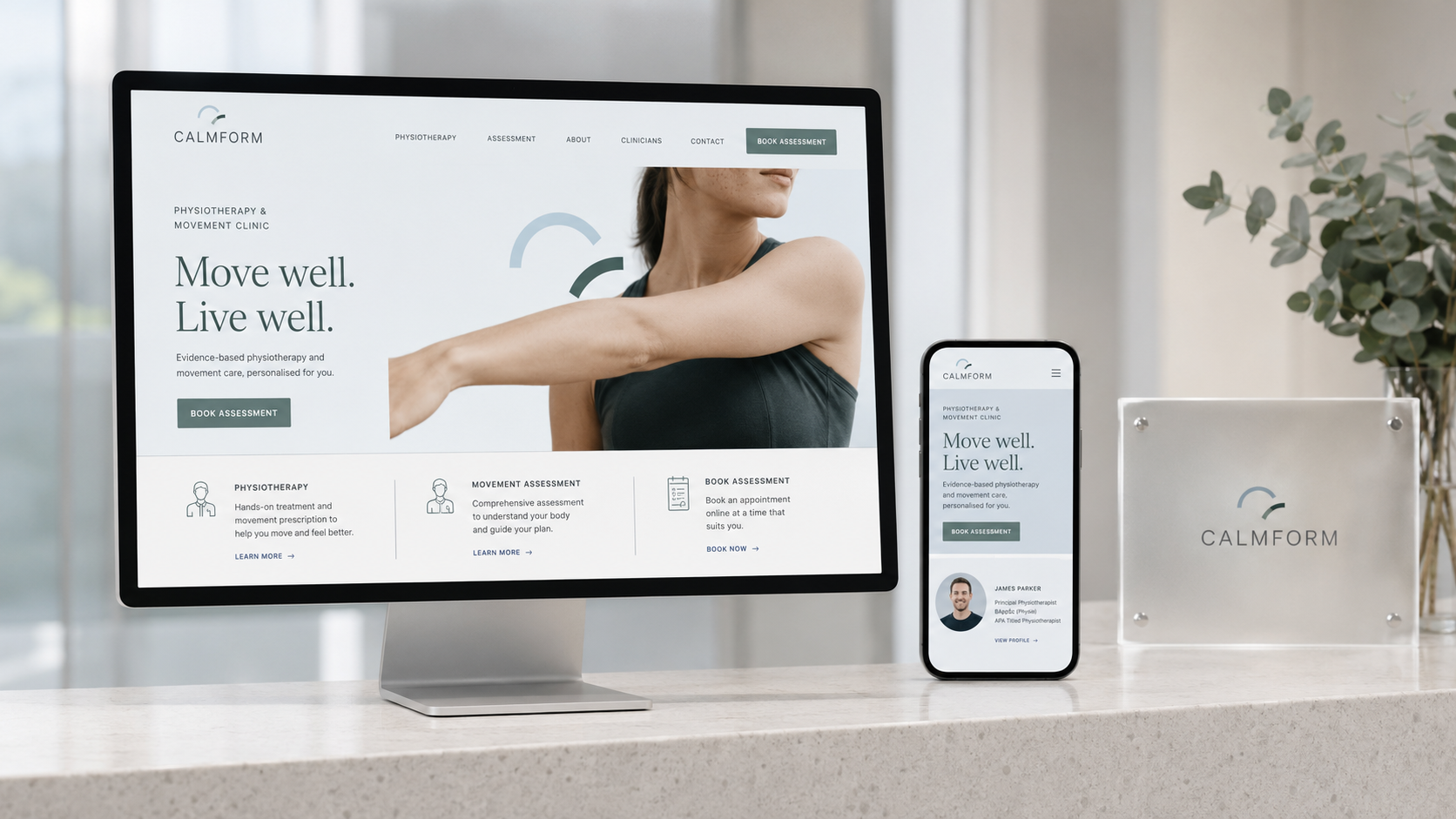 Calmform physiotherapy website displayed on a desktop and smartphone on a marble countertop with a plant in background.