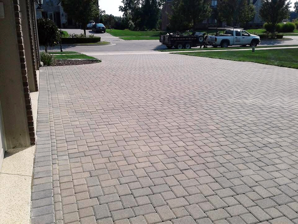 Heritage Landscape Professional masonry installation showcasing a custom brick paver patio design.