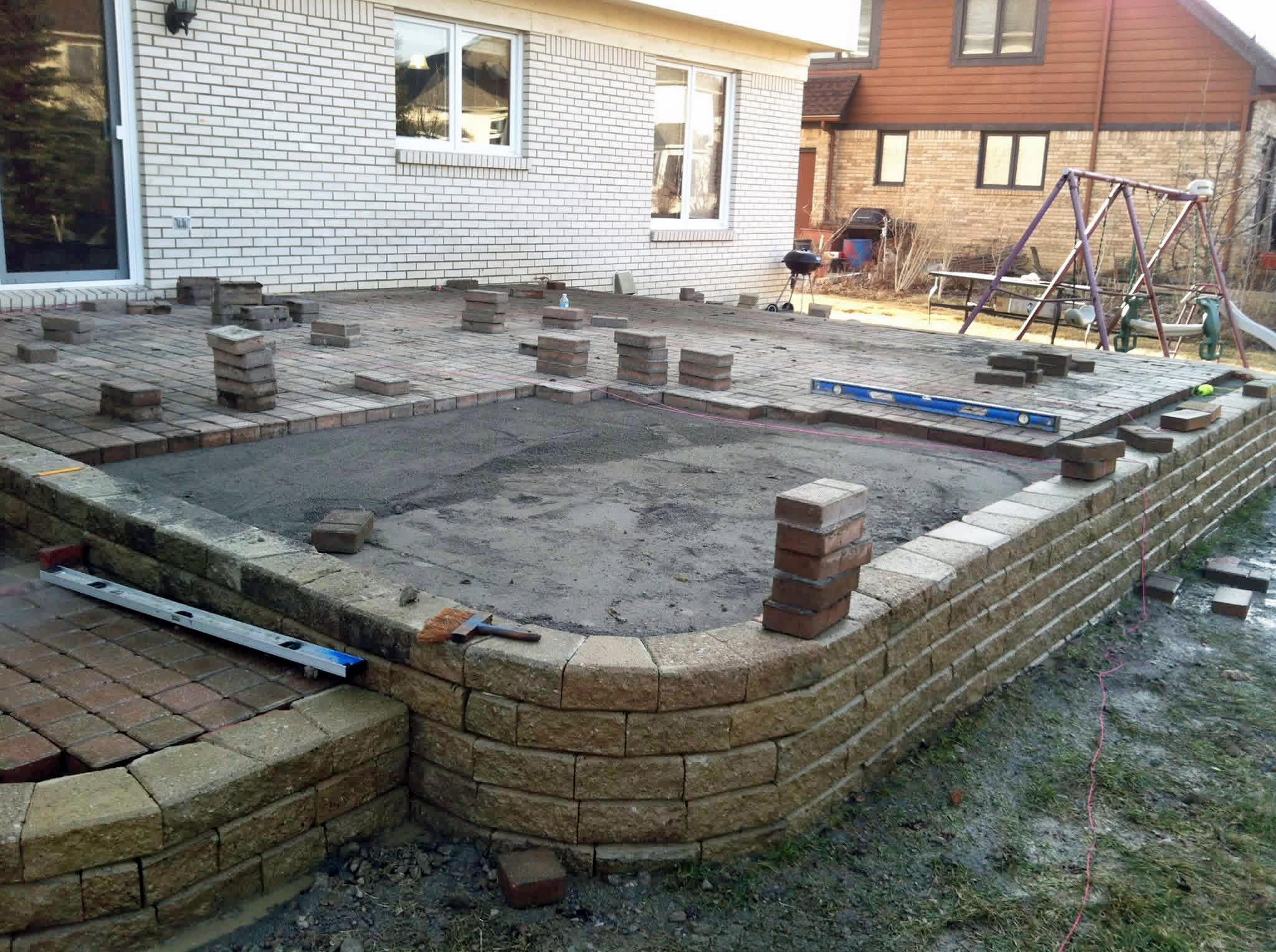 Heritage Landscape Raised brick paver patio and retaining wall project.
