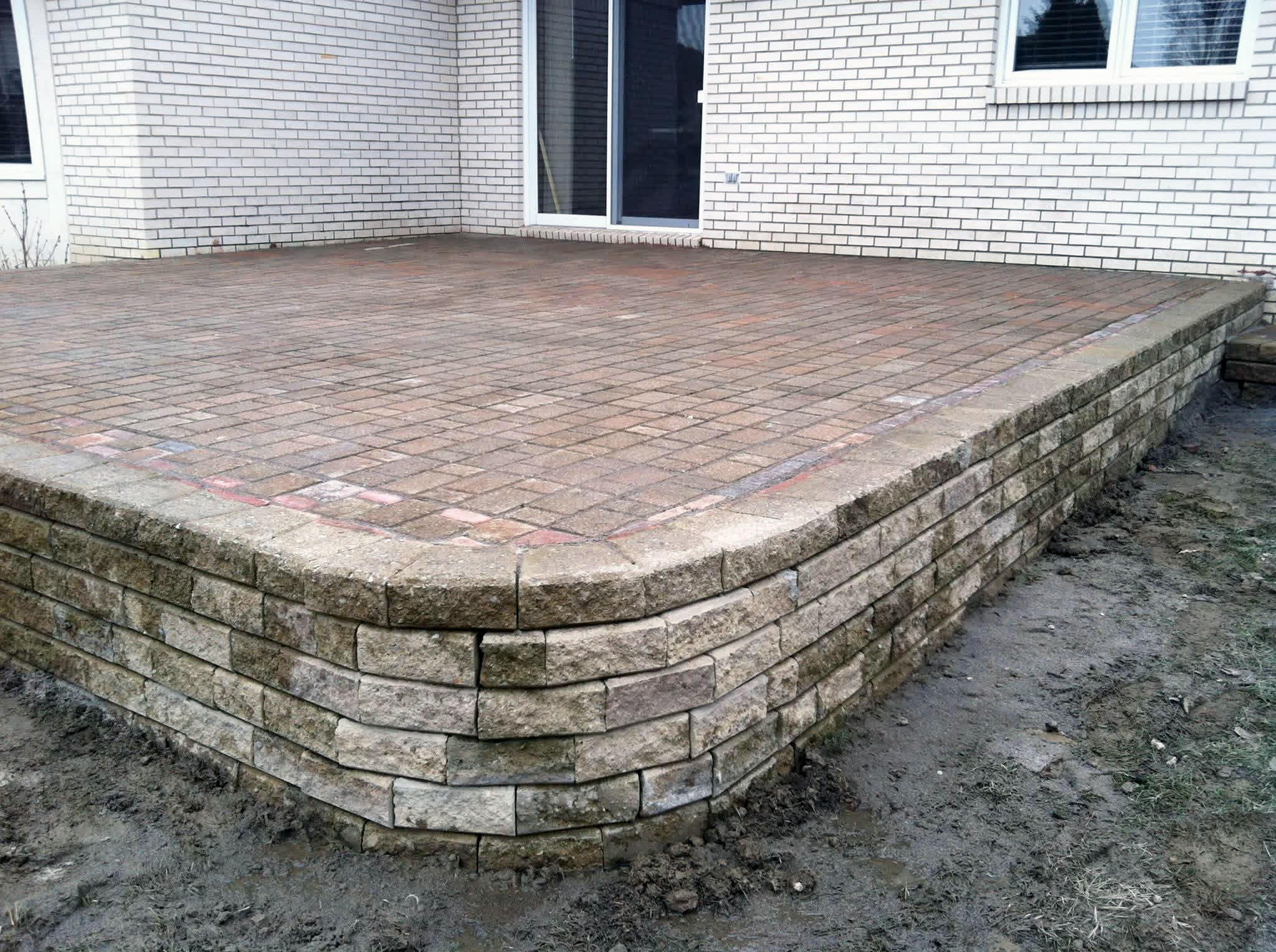 Heritage Landscape Raised brick paver patio and retaining wall project.