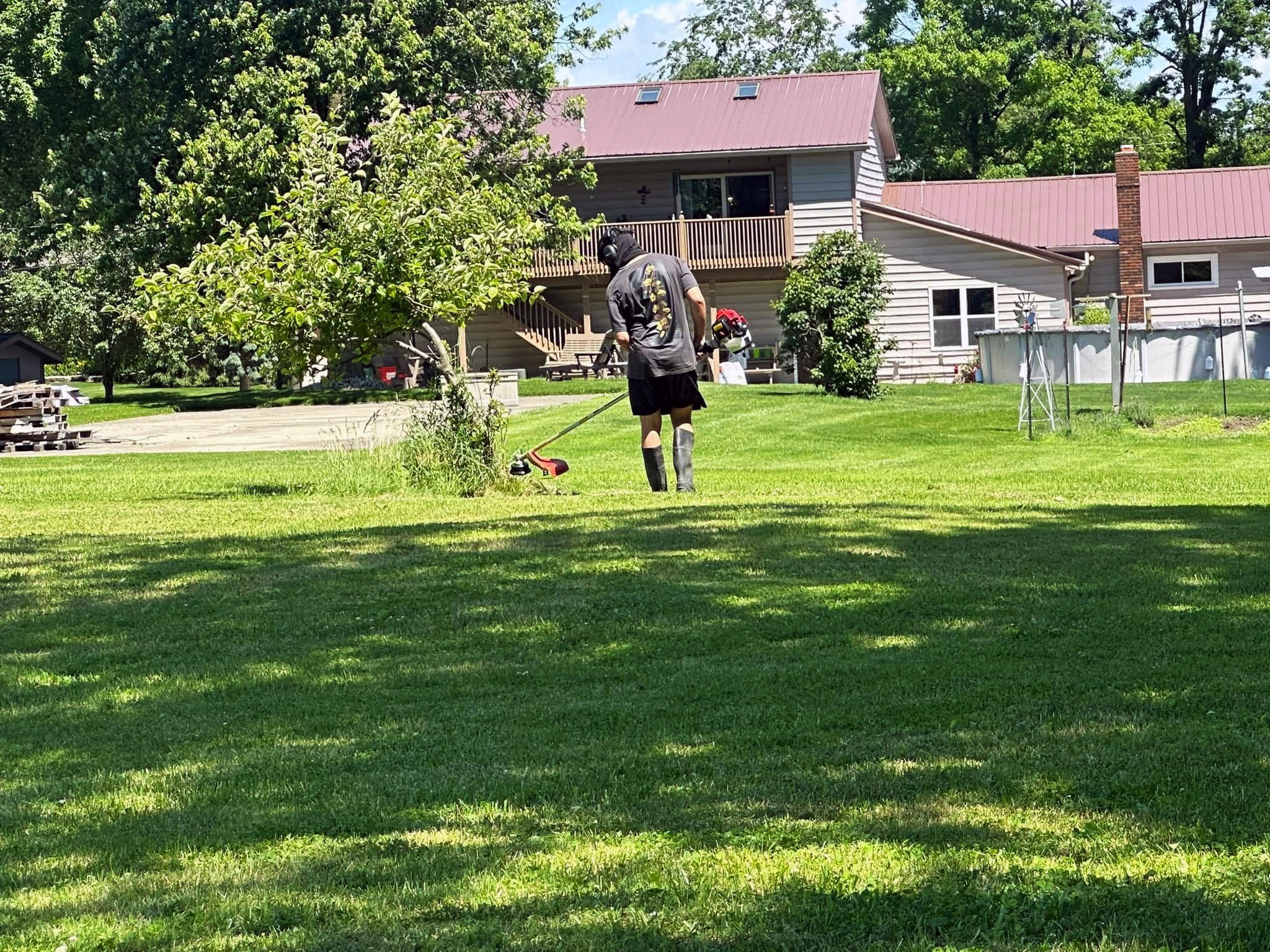 Heritage landscape personnel cutting grass