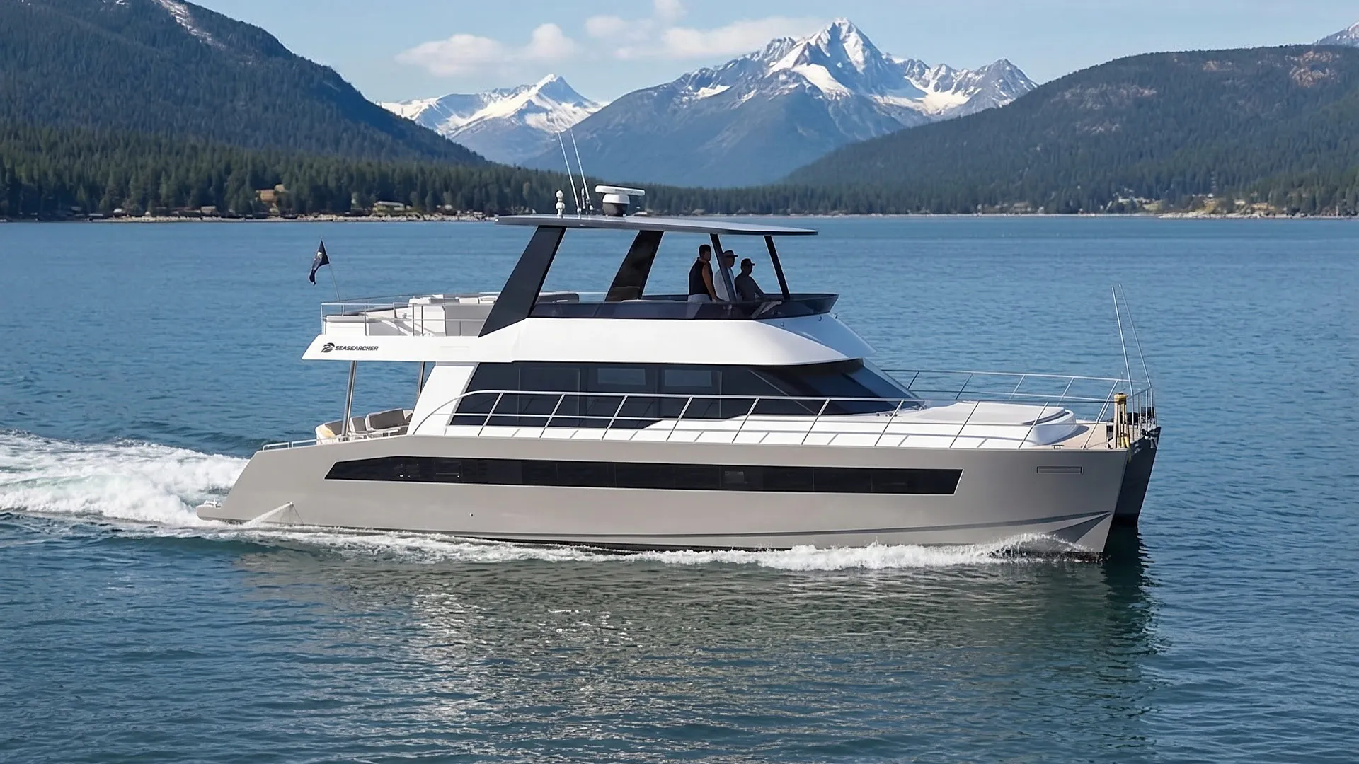 Modern motor yacht cruising on calm blue lake with snowy mountains and forested hills in the background.