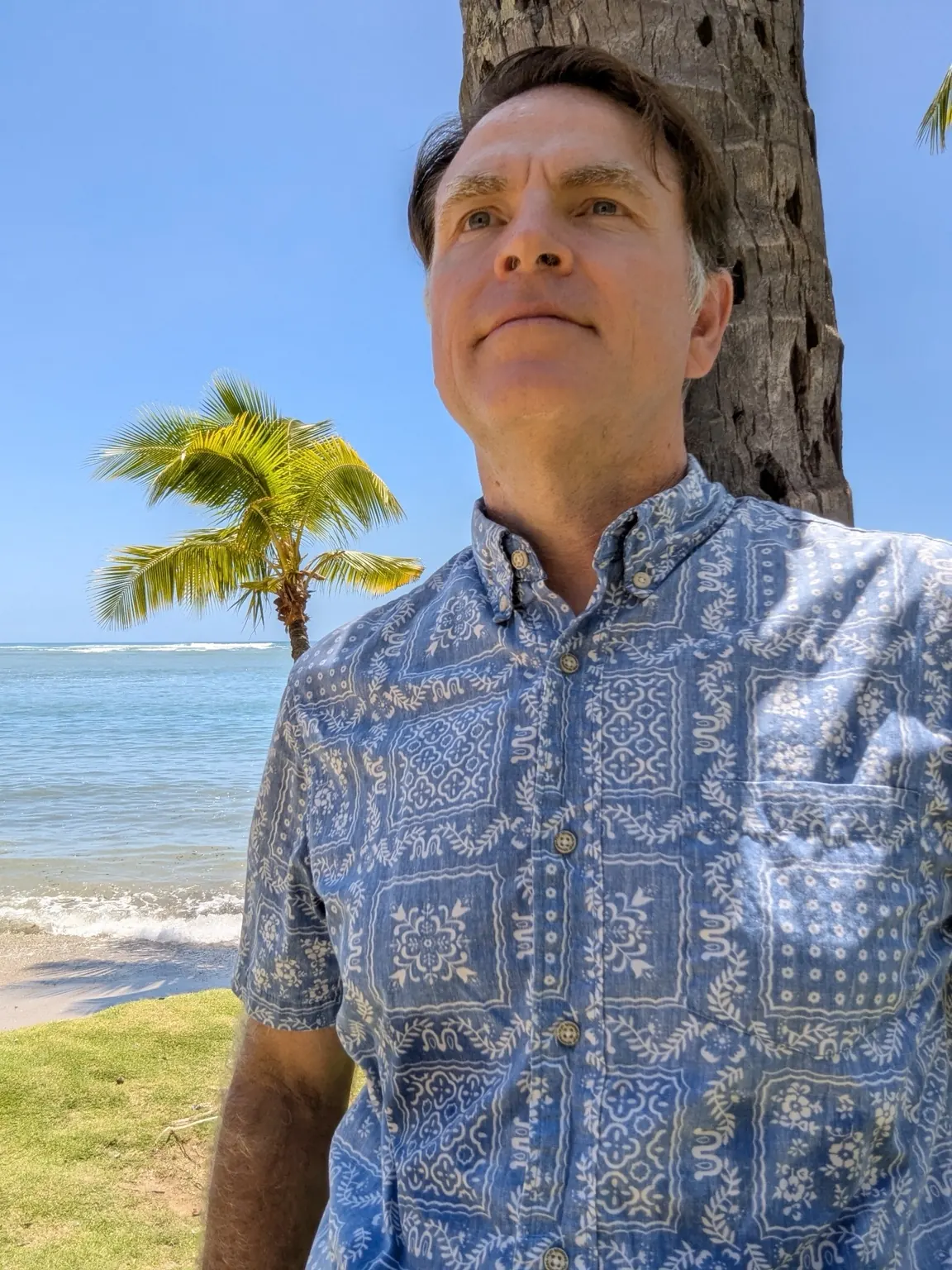 Paul Lovejoy looking toward the ocean at a tropical beach