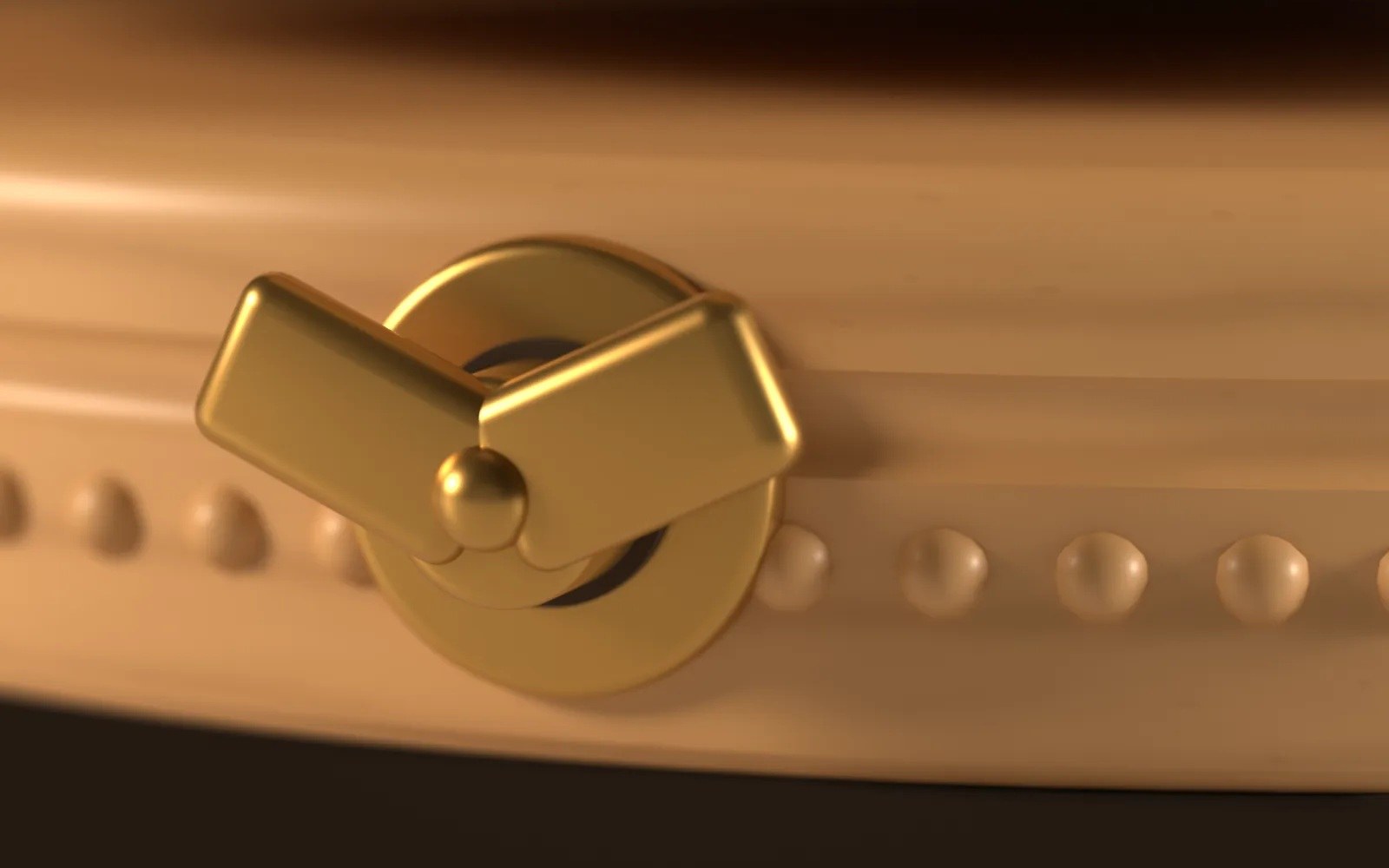 Close-up of the brass winding key on the beech base, with the carousel turning behind it in motion blur.