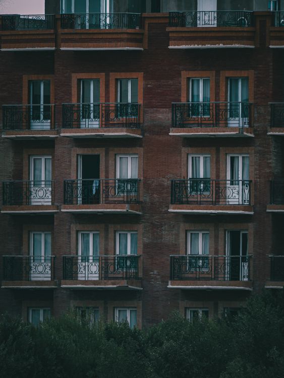Modern apartment building with balconies and large windows