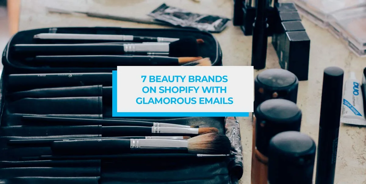 Make-up brushes and cosmetics laid out on a table.