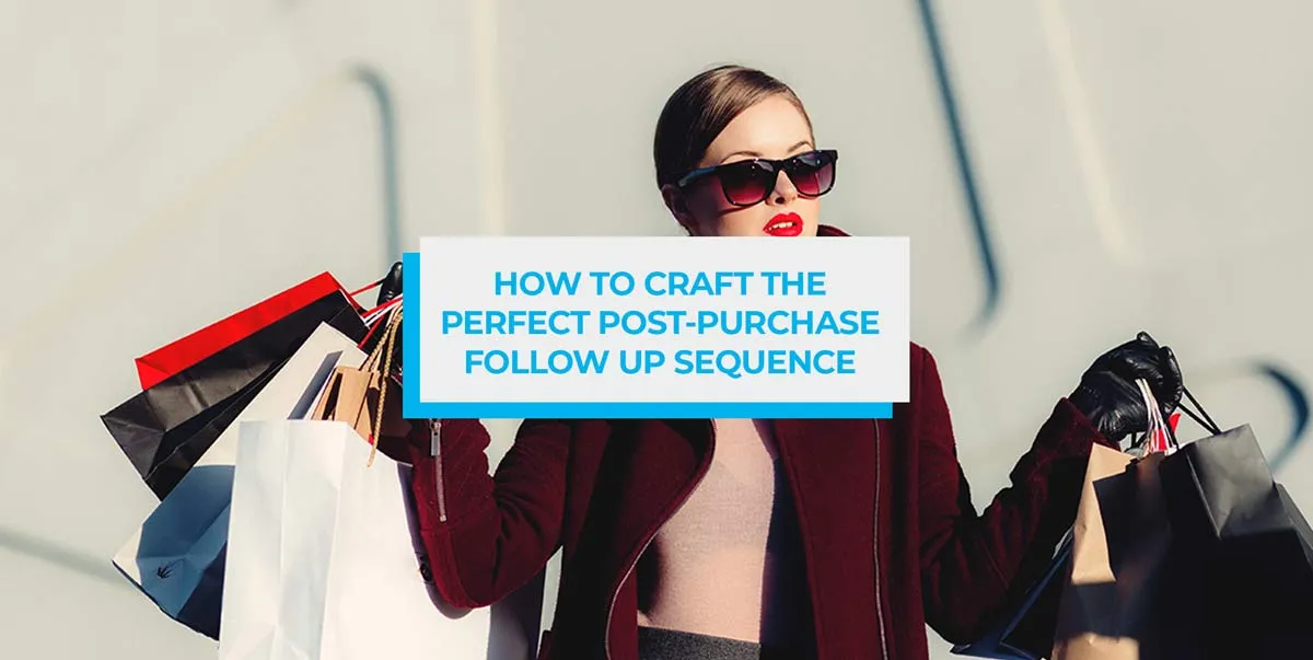 Woman in sunglasses carrying several shopping bags in both hands.
