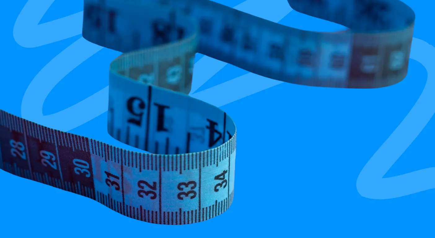Coiled tailor's tape measure showing centimetre markings.