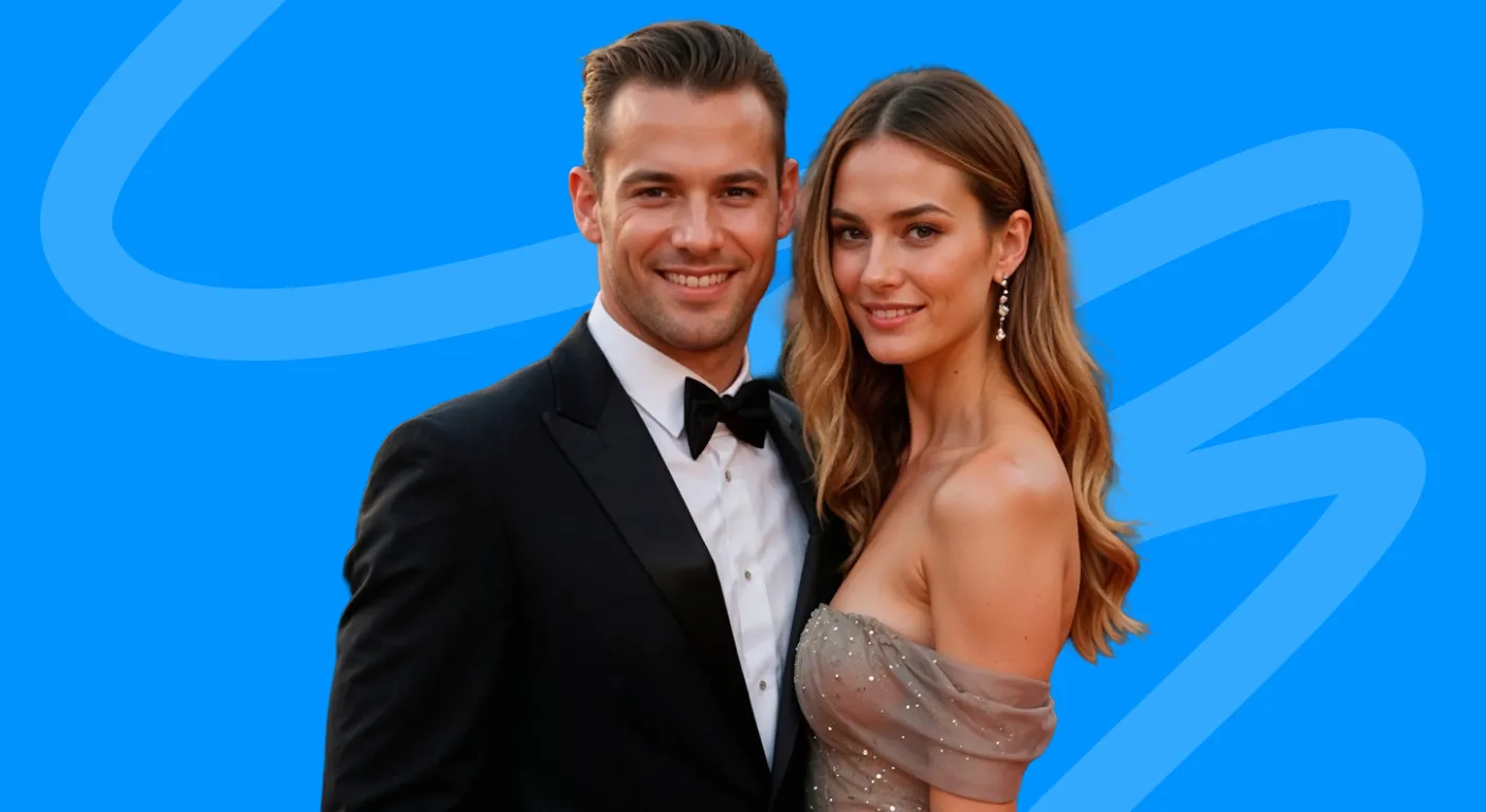 Couple in a tuxedo and sequinned evening gown posing on a red carpet.